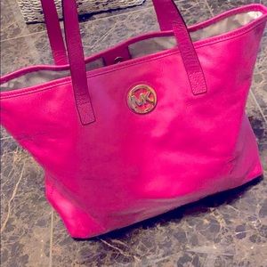 Pink Michael Kors tote bag with MK logo